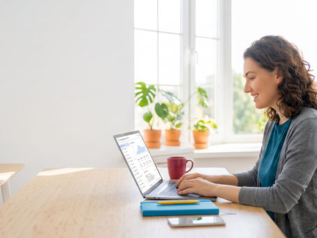Small business owner viewing her Google Business Profile dashboard on a laptop