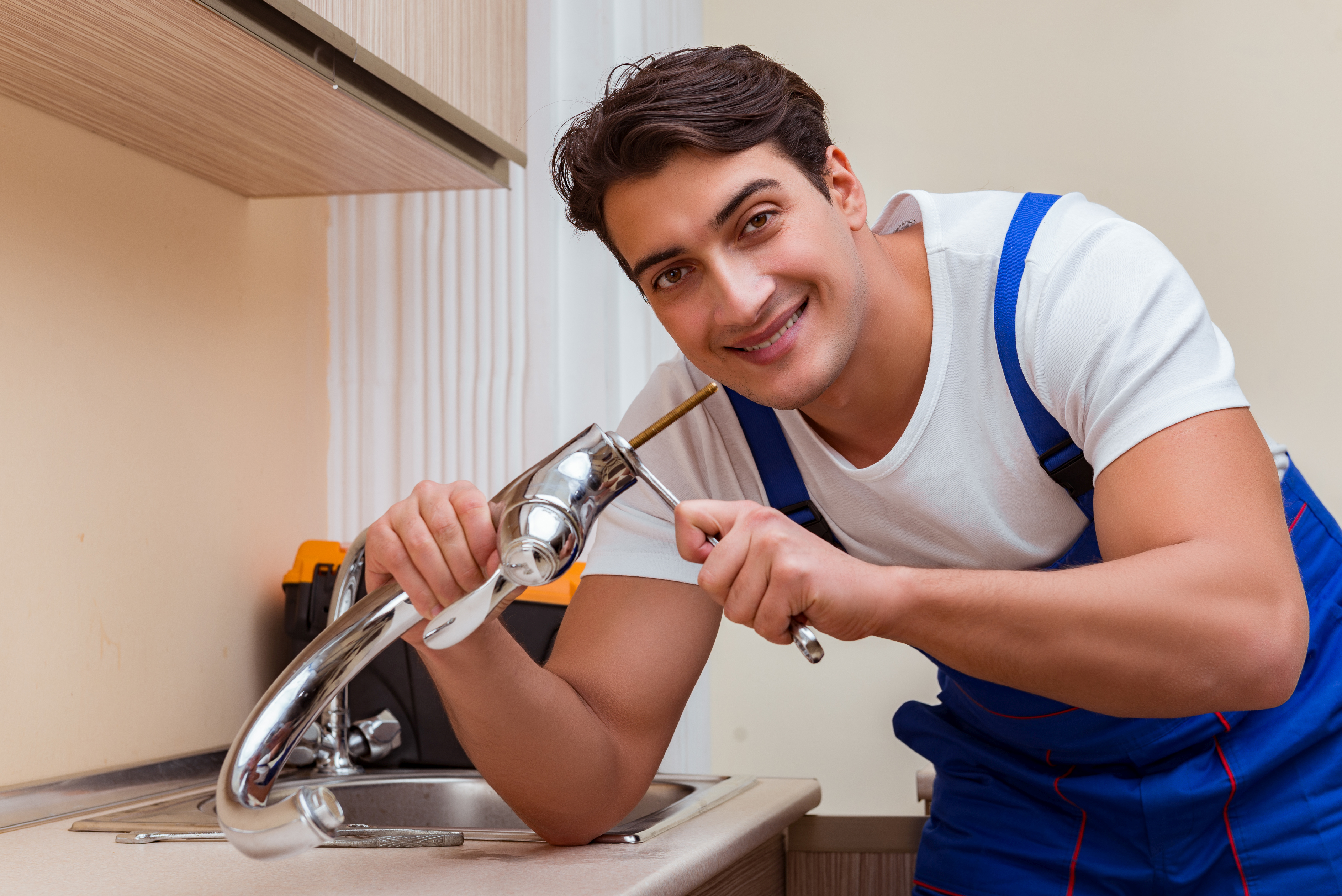 young-repairman-working-kitchen.jpg