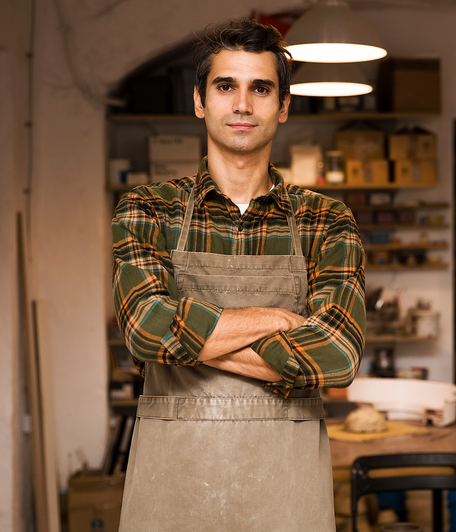 handsome-young-man-posing-pottery-workshop.jpg