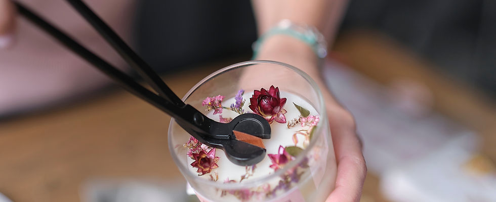 Cutting the wick out of handmade soy candles. Candle making utensils. Cruelty-free vegan p