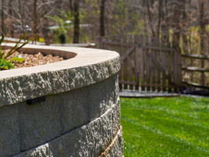 Transforming Your Outdoors: The Lasting Impact of Stone Pathways and Retaining Walls