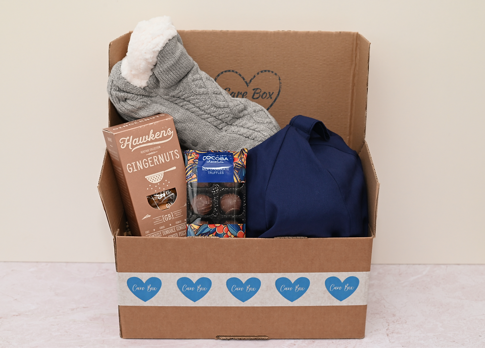 Thumbnail: Fluffy socks, ipad holder, truffles and ginger biscuits inside care box