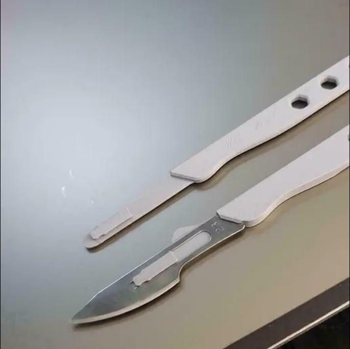3D-printed scalpel handles composed of polylactic acid filament, a renewable and biodegradable bioplastic made from fermented plant starches. Using PLA, these scalpel handles can be produced for about $1 USD per unit, and while they are not compatible with autoclaving, they can be safely sterilised [4], and future iterations printed with other materials such as carbon fibre will be autoclave-compatible.