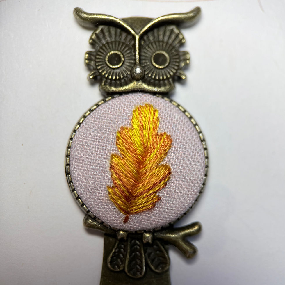 Close-up of pink oak leaf owl embroidered bookmark