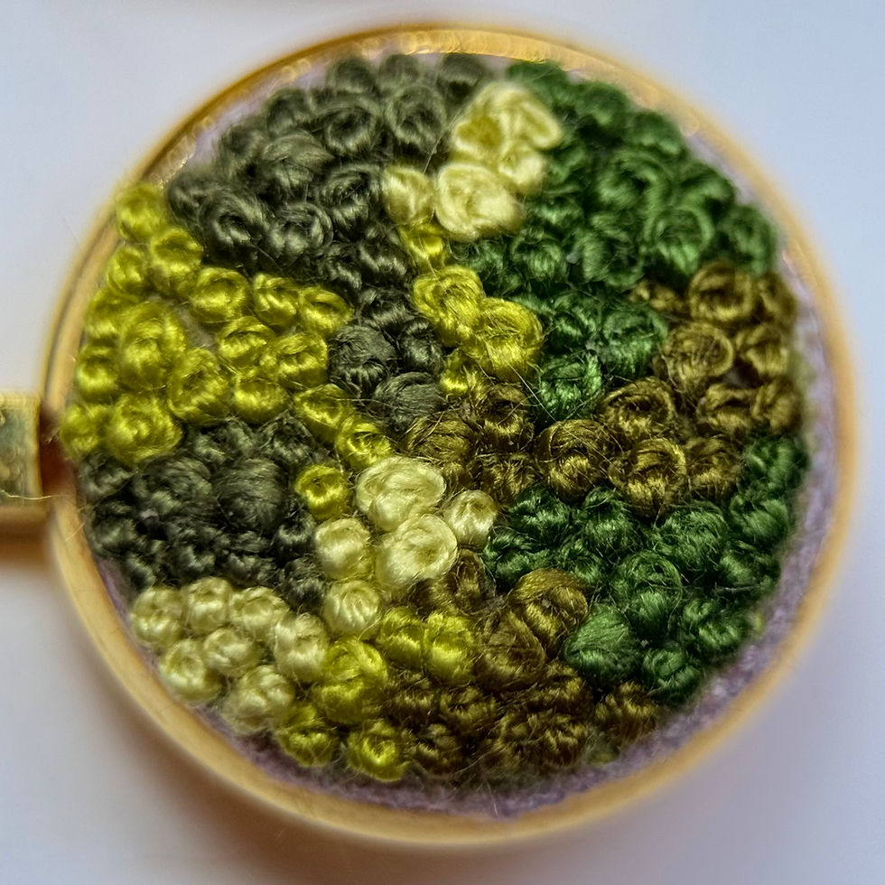 Thumbnail: Close-up of green moss embroidered hair grip