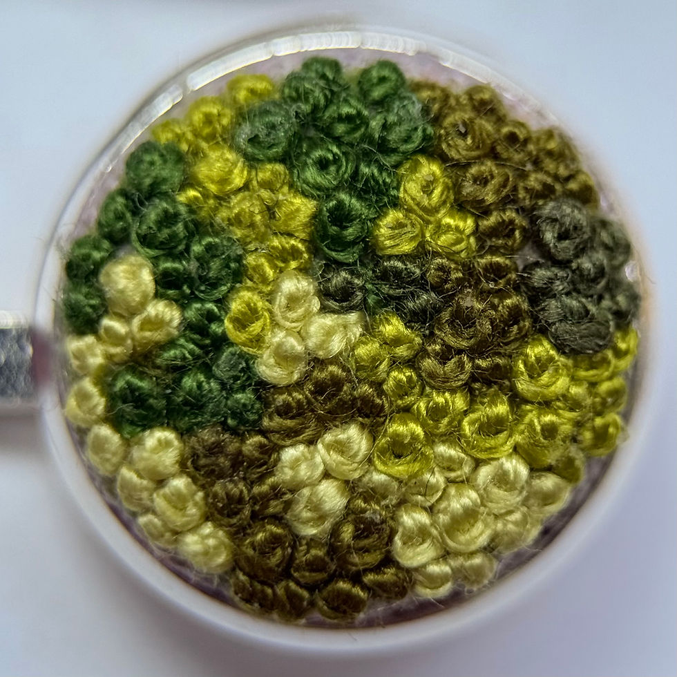 Thumbnail: Close-up of green moss embroidered hair grip