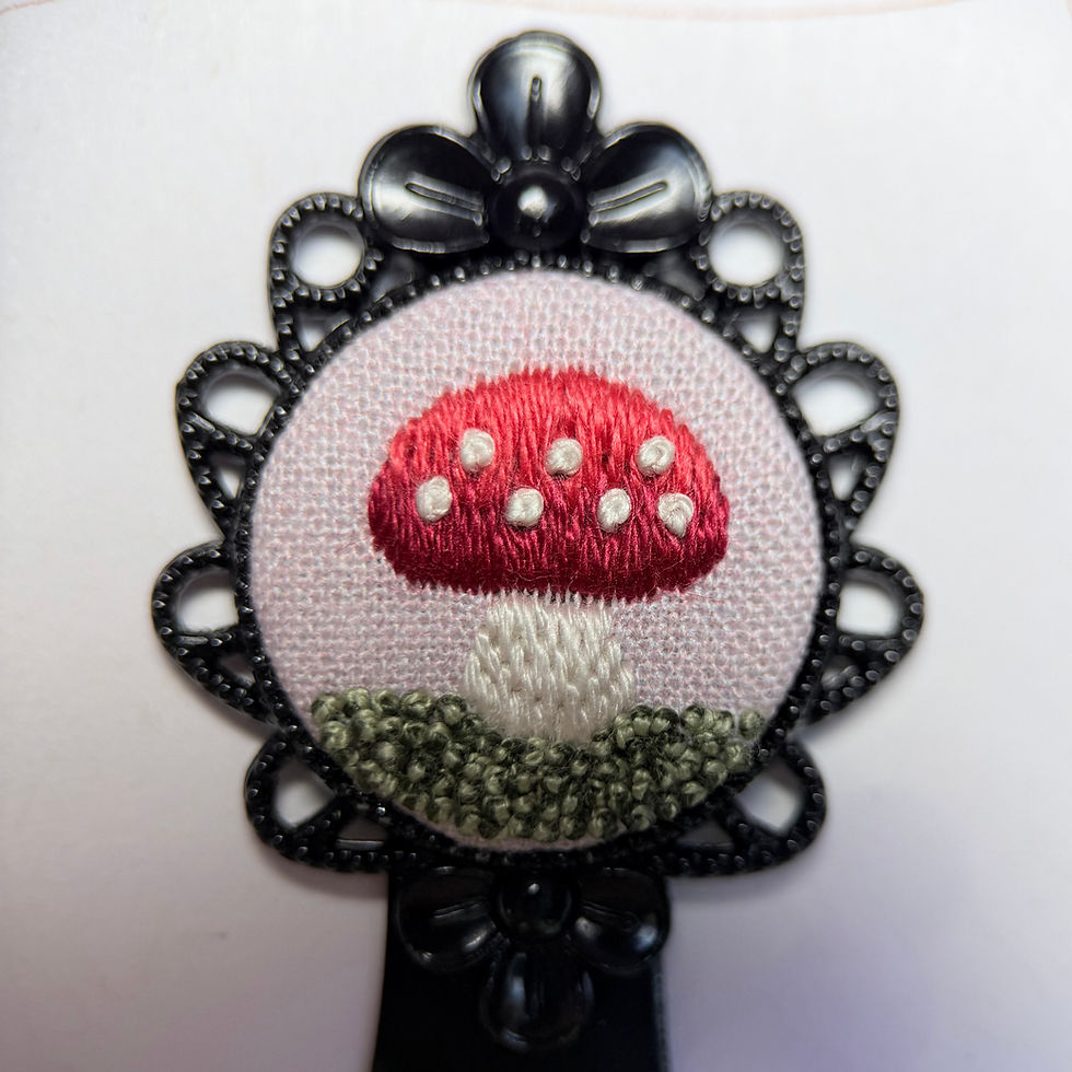 Close-up of pink mushroom embroidered bookmark