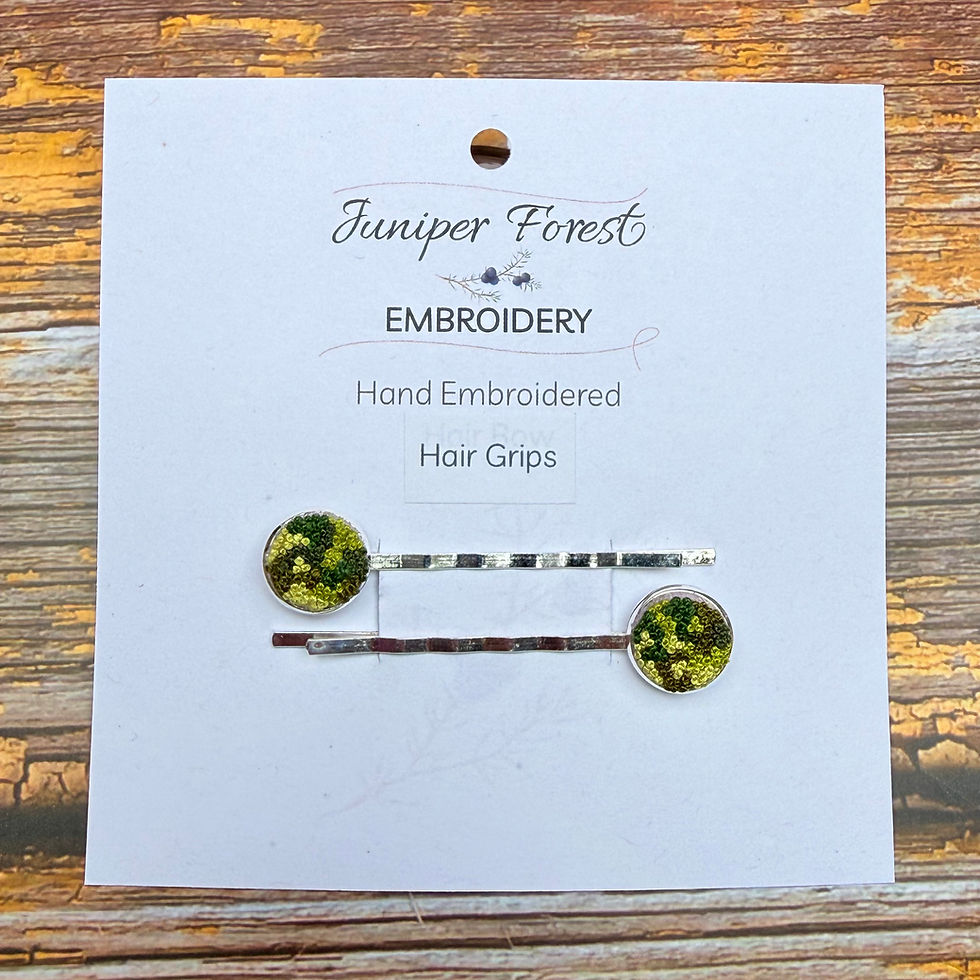 Thumbnail: Green moss hand embroidered hair grips on display card