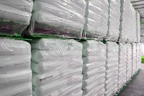 Stacked sacks of raw materials in the RSH warehouse for trade