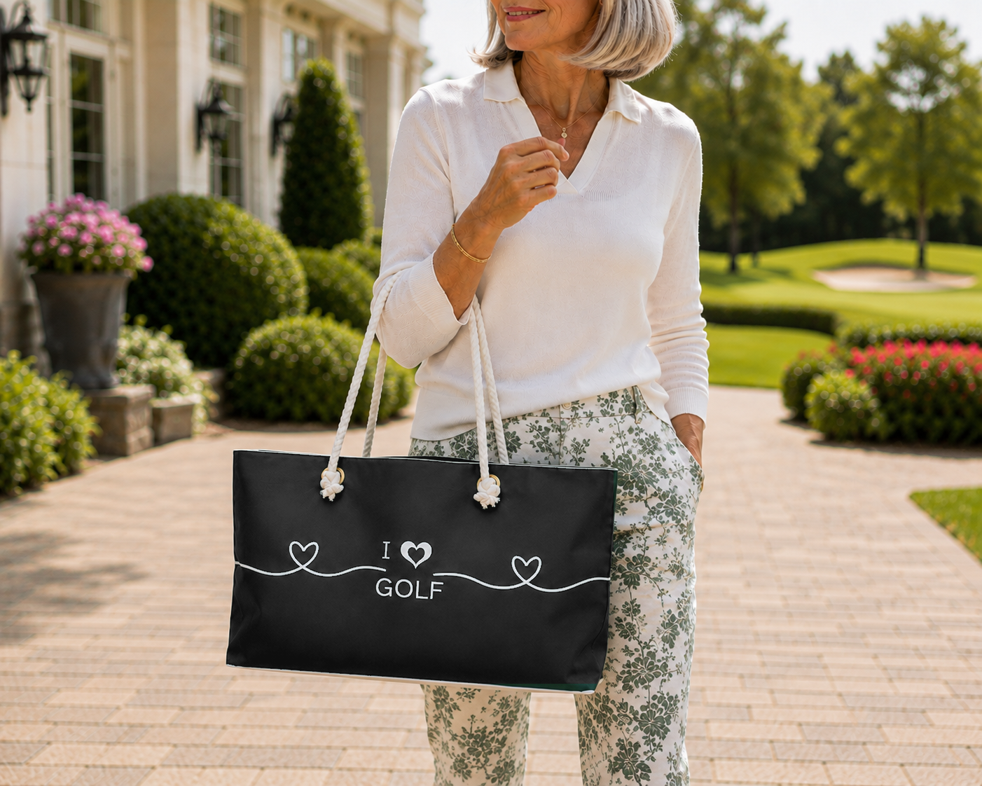 I Love Golf weekender bag with white rope handles and heart design, a stylish golf travel bag and gift for women golfers.