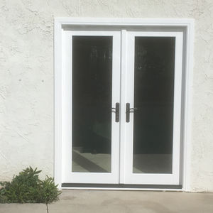 a new white french door with a black handle