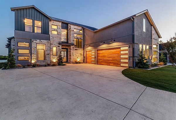Luxury lakefront estate at dusk in Heath, TX on Lake Ray Hubbard