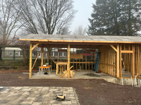 Unfinished wooden backyard structure under construction