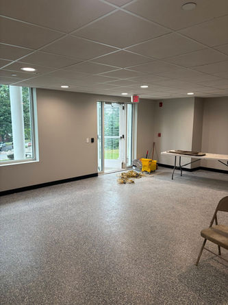 Empty room, door ajar, awaiting furniture