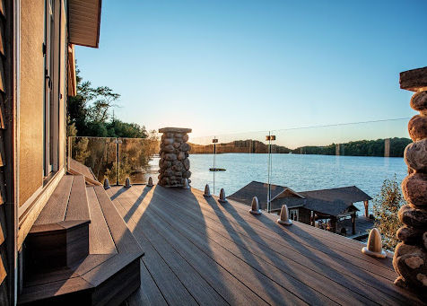 Composite lakefront deck with glass railing