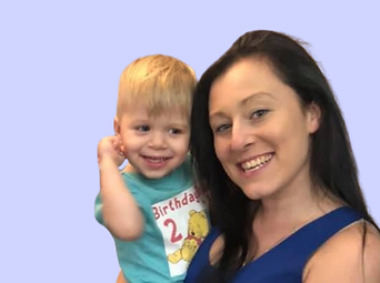 Natalie from Natalie's Sweets holding a boy in her arms.