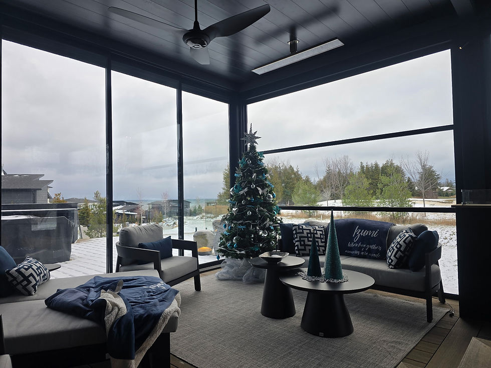 Enclosed room on a deck decorated for the holidays.