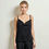 Миниатюра: Model in black viscose draped top, minimal movement, soft lighting and natural motion