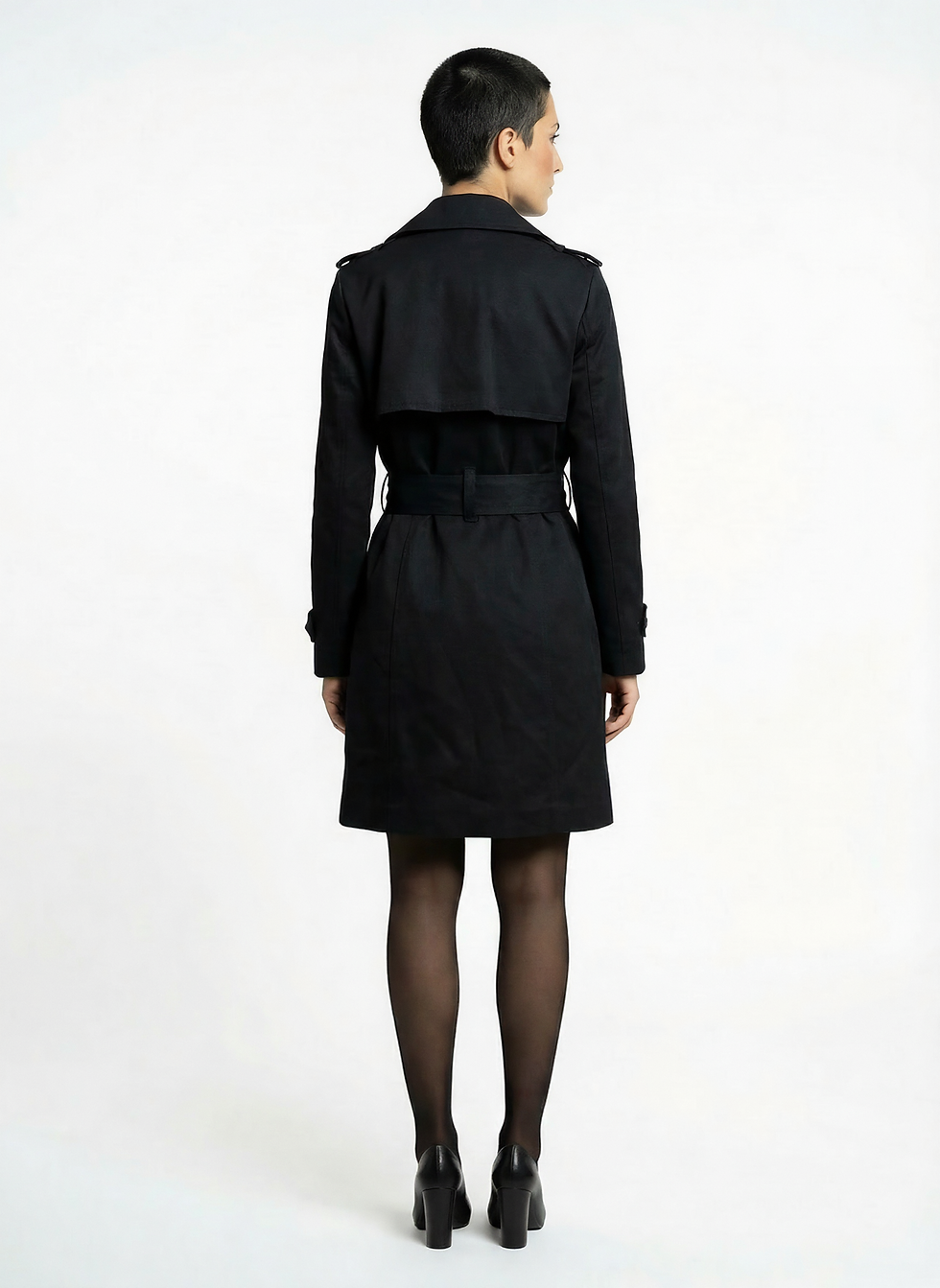 Миниатюра: Back view of a black trench coat with belt, clean lines and structured fit.