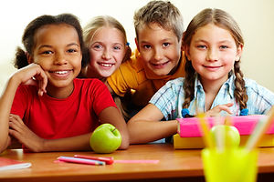 Portrait of smart schoolchildren looking