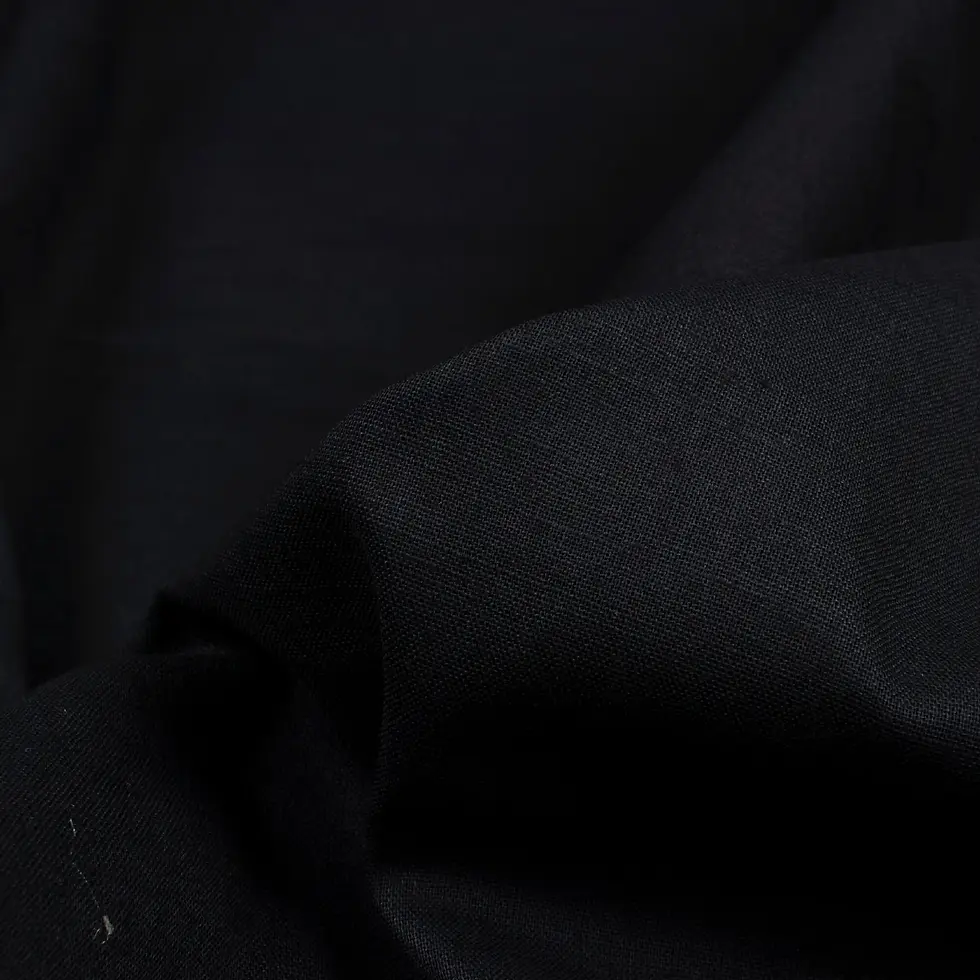 Close-up view of Ebony Midnight Plain Cotton Cambric Fabric, showing the fine texture and smooth surface.