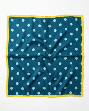 Teal satin scarf with light blue polka dots and yellow border laid flat.