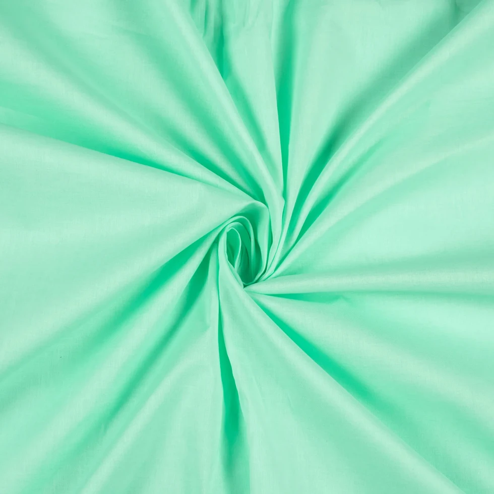 Spring Breeze Plain Cotton Cambric Fabric displayed with a swirl pattern.