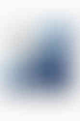 A folded white scarf showing the color block border in shades of blue.
