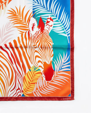 Zebra print with palm leaves on satin scarf corner