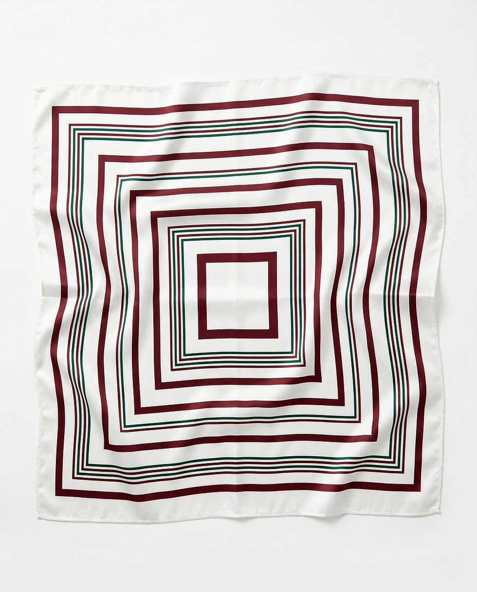 White satin scarf with maroon and green square stripe pattern laid flat