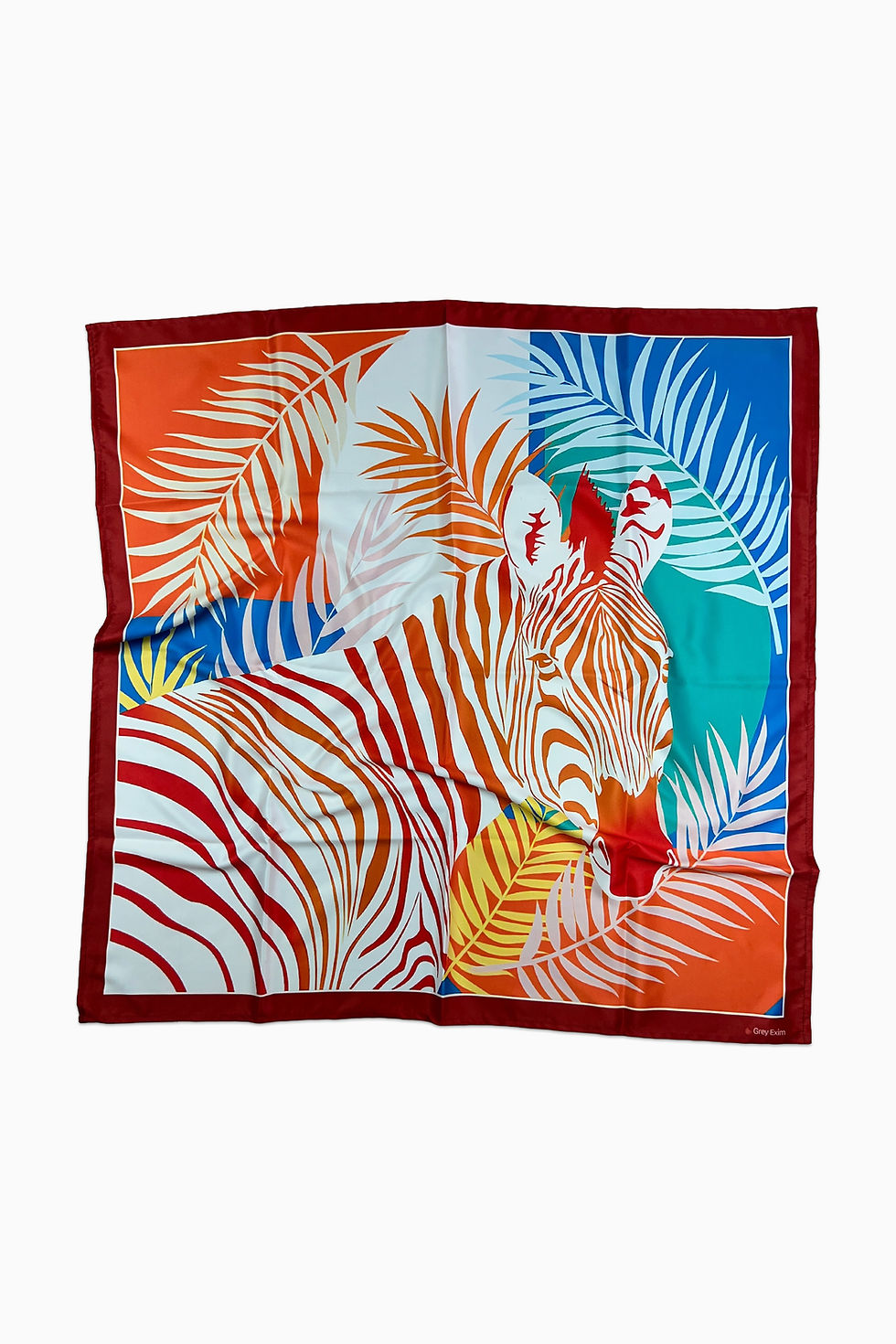 A colorful square scarf featuring a red and orange striped zebra among palm leaves.