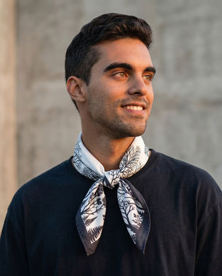 Man wearing monochrome tree print bandana scarf