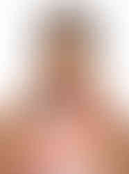 Woman wearing a multicolor zebra-print satin scarf.