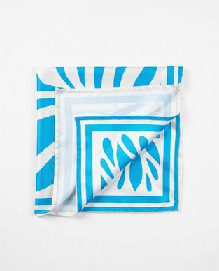Folded blue and white satin scarf with leaf pattern