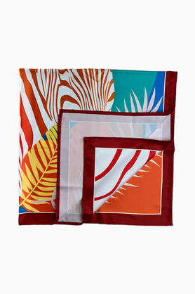 A folded square scarf showing the colorful zebra and palm leaf design sections.