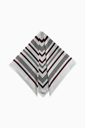 A white scarf with a geometric line pattern folded into a triangle.