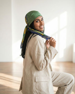 Woman wearing olive green constellation print square scarf as headscarf