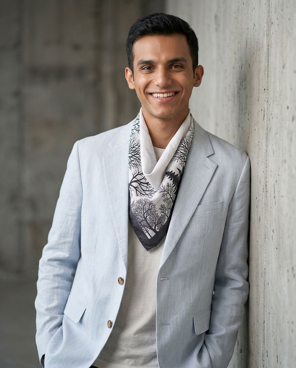 Man wears abstract print square scarf