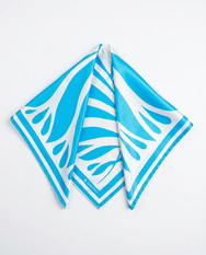 Draped blue and white satin scarf on white background