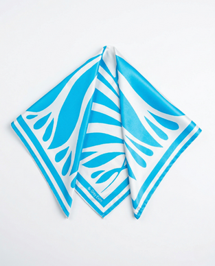 Draped blue and white satin scarf on white background