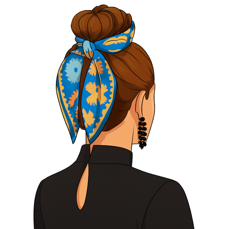 A blue and yellow floral scarf is wrapped around a high hair bun.