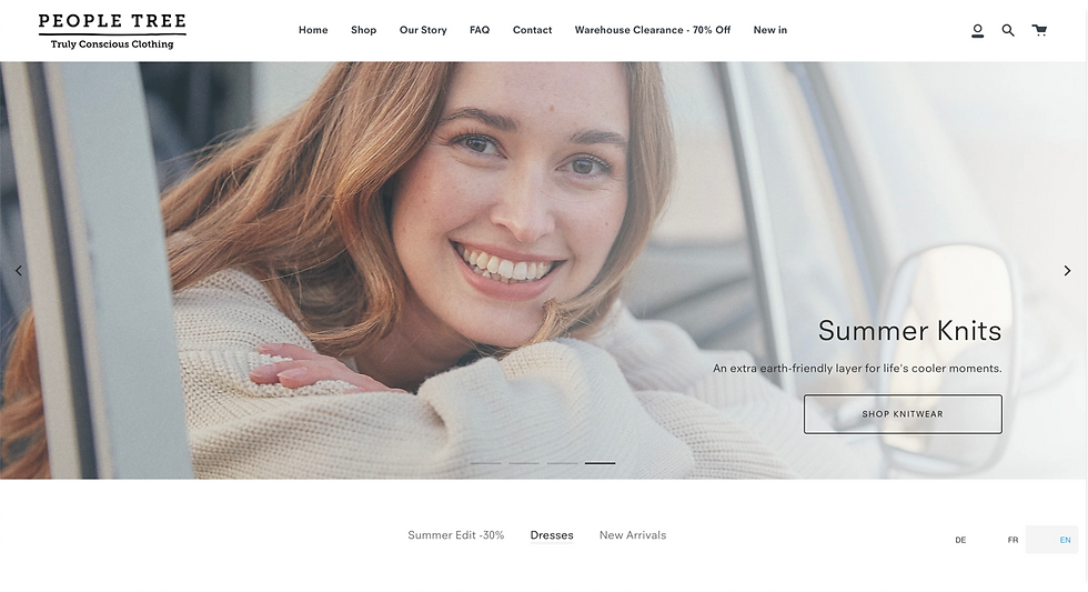 Man in een werkplaats en vrouw in een busje, gekleed in geruite overhemden. Tekst: "The Outerknown Blanket Shirt." Eronder een tentoonstelling van geruite overhemden. Stemming: casual.