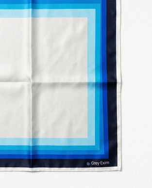 Blue gradient border on white satin scarf corner