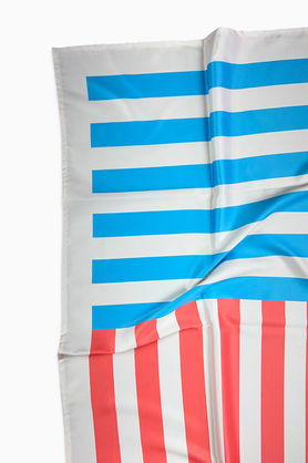 A close-up of a satin scarf showing the blue and red striped sections.