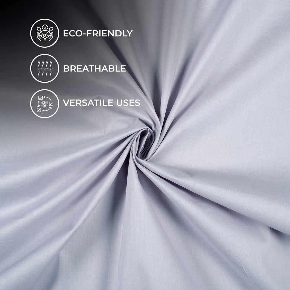 Eco-friendly, breathable, and versatile uses icons overlaid on Silver Mist Plain Cotton Cambric Fabric displayed.