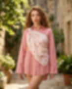 Woman wears pink floral printed square scarf outdoors