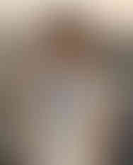 Woman wearing black and white scarf around neck