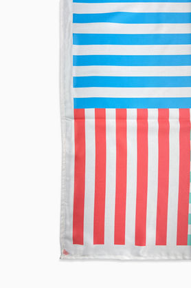 A close-up of a satin bandana showing the blue and red striped sections.