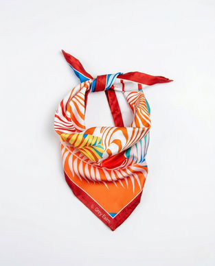 Satin scarf tied in triangle bandana style