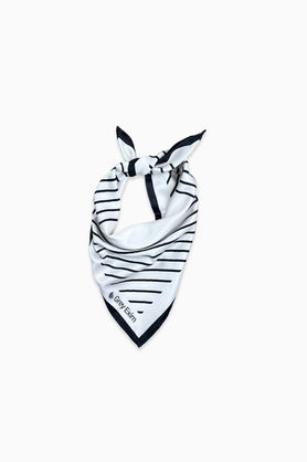 A white and black geometric print bandana tied in a knot.